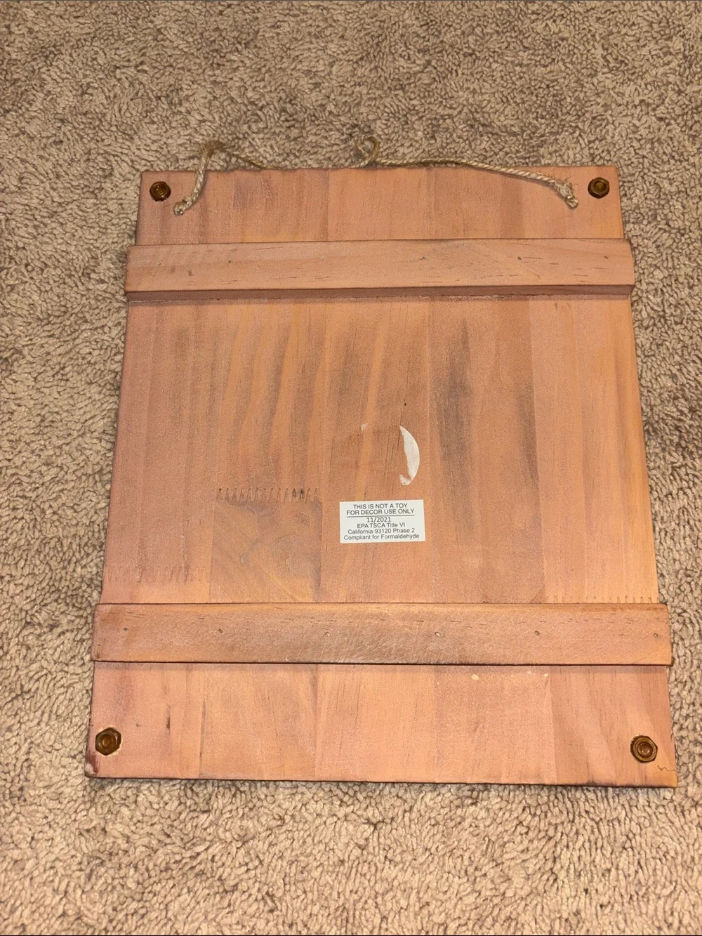 Source Unknown Pink Wood Sign with Black Lettering